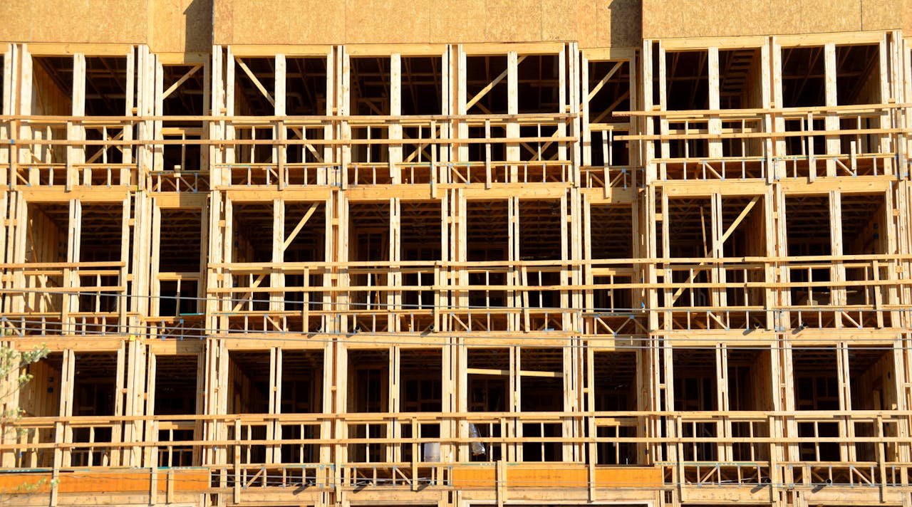 Close-up of wooden structure showcasing a modern building during construction phase.